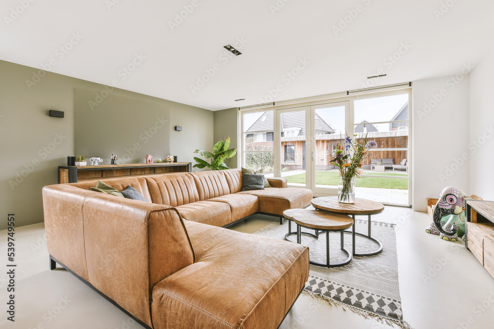 Spacious living room glass doors leading to backyard Spacious living room glass doors leading to backyard
