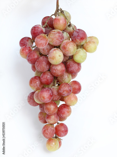 Red fresh grapes isolated on white background