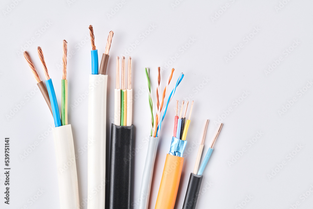 Electric cables, many copper wires with colored isolation isolated on white background Electric cables, many copper wires with colored isolation isolated on white background