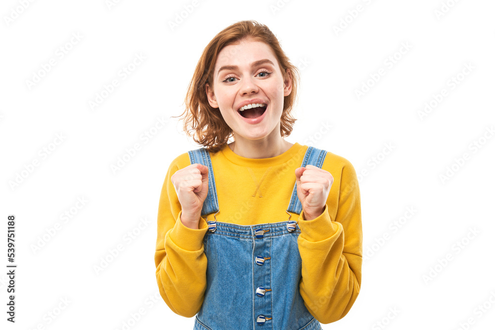 Portrait of positive redhead girl in casual jeans emotionally rejoices and feels happy isolated on white background, advertising banner Portrait of positive redhead girl in casual jeans emotionally rejoices and feels happy isolated on white background, advertising banner