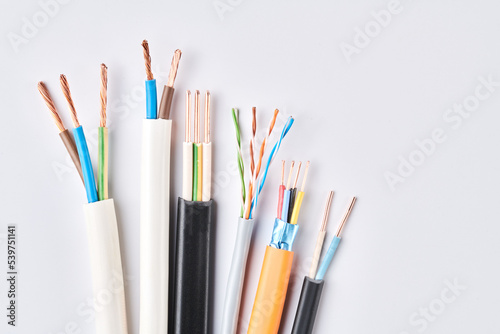 Electric cables, many copper wires with colored isolation isolated on white background © amixstudio