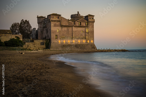 Santa severa castle with its golden beach photo