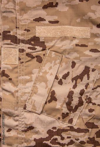 US marine desert marpat digital camouflage fabric texture back. Close-up of a fragment of a military uniform.