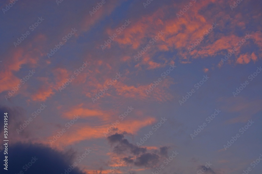 Colorful, evening sky in the rays of an autumn sunset.