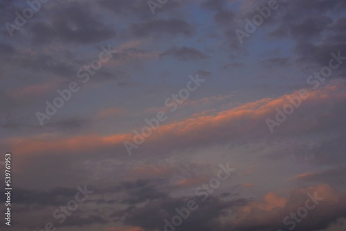 Colorful, evening sky in the rays of an autumn sunset.