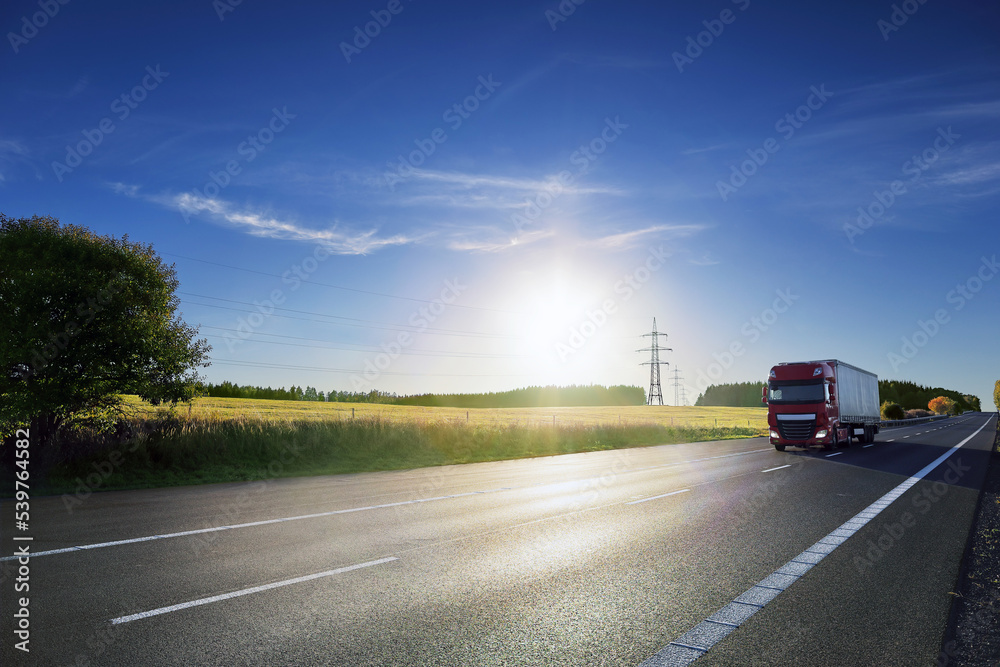 Truck transport on the road at sunset and cargo Truck transport on the road at sunset and cargo