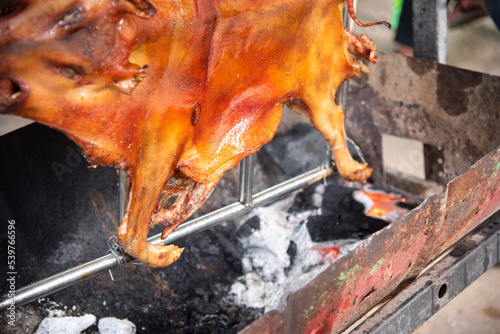 Roasted whole pig, slow grilled pork,  delicious hot food 