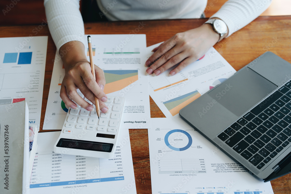 Accountants, Asian auditors are using calculators and computers to review annual tax budgets to submit information to the IRS.