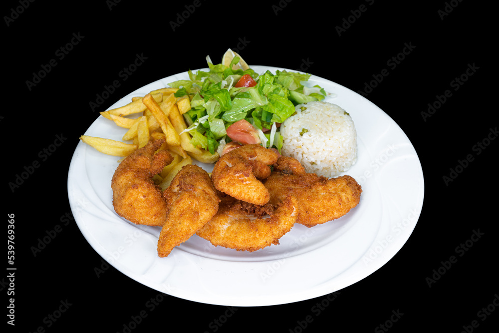 Fried chicken strips in a white plate on a black background Fried chicken strips in a white plate on a black background