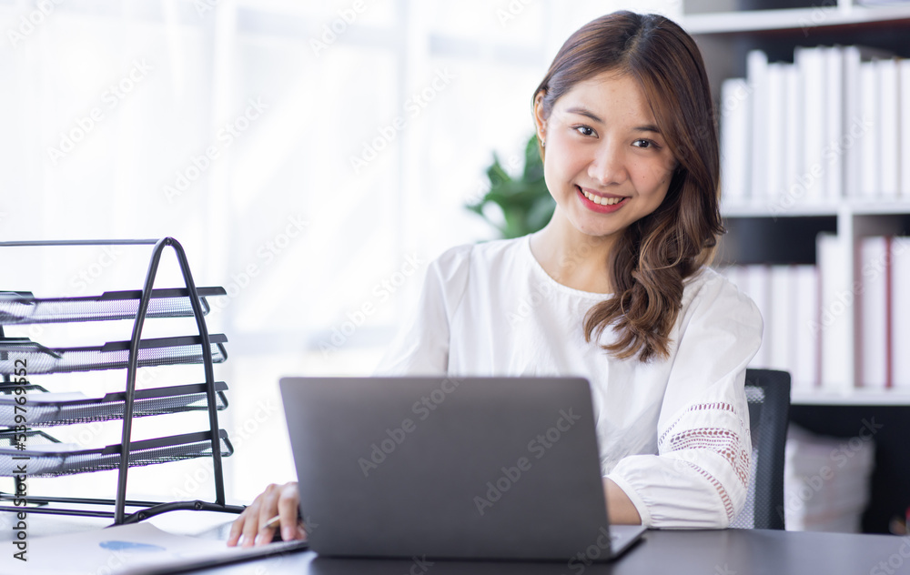 Happiness Entrepreneur beautiful business asian young woman working with laptop at workplace, Small Business Startup, online banking tax, accounting, financial concept. Happiness Entrepreneur beautiful business asian young woman working with laptop at workplace, Small Business Startup, online banking tax, accounting, financial concept.
