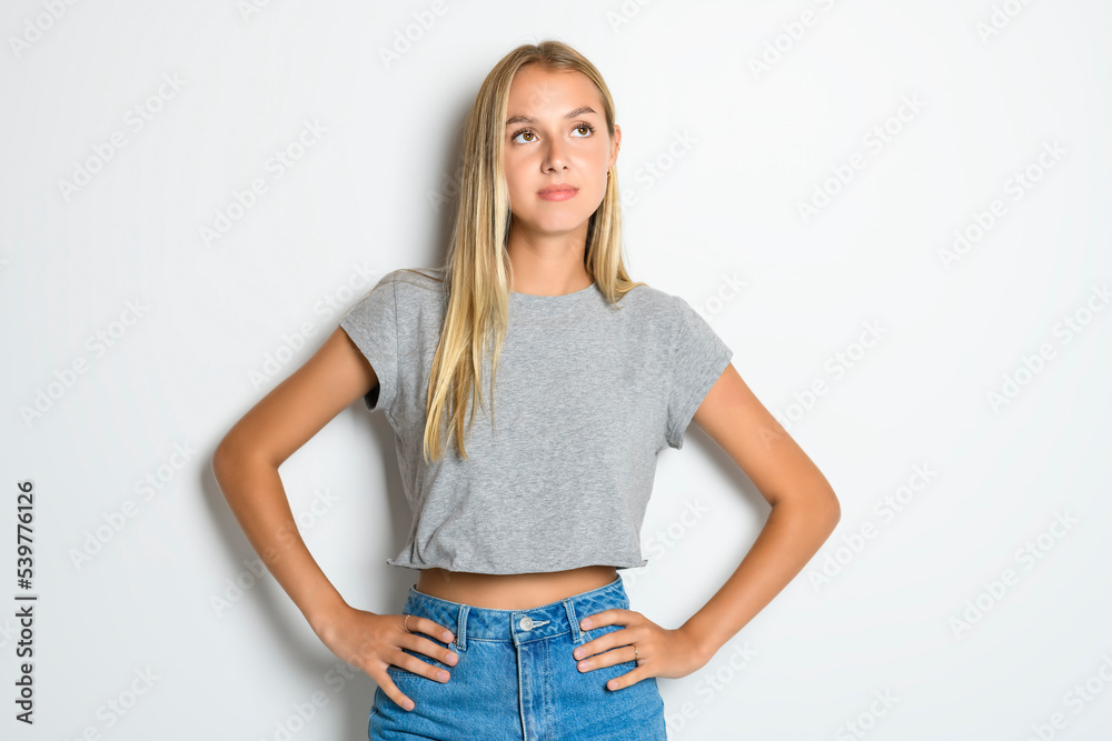 Portrait of young beautiful cute girl smiling looking at camera over white background. Portrait of young beautiful cute girl smiling looking at camera over white background.