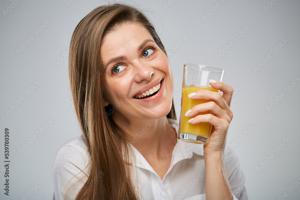 Smiling woman drinking orange juice. Isolated female advertising portrait. Smiling woman drinking orange juice. Isolated female advertising portrait.