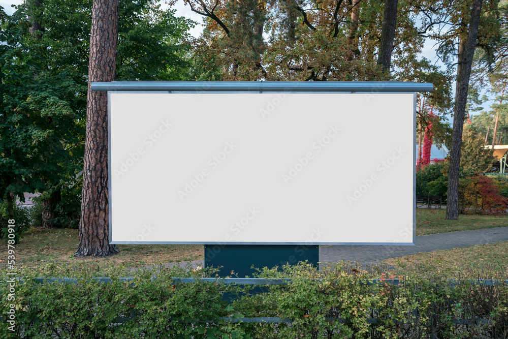 Large blank banner with white copy space for mockup standing at urban park in autumn season outdoor Large blank banner with white copy space for mockup standing at urban park in autumn season outdoor