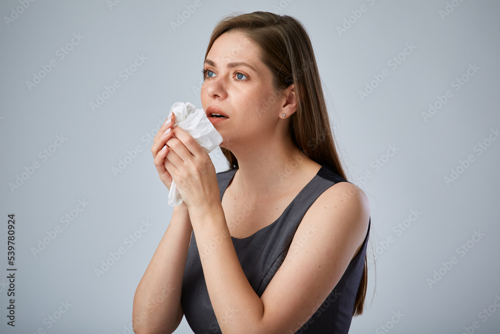 Sick coughing business woman using napkin. isolated advertising portrait. Sick coughing business woman using napkin. isolated advertising portrait.