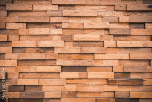 Textured background of horizontal brown plank wall stacked together in layers. wooden wall background