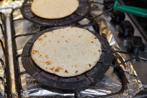 grilled arepas. arepa paisa traditional from the region of antioquia in colombia.