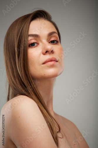 Beauty style close up face portrait of young woman. Isolated studio portrait.