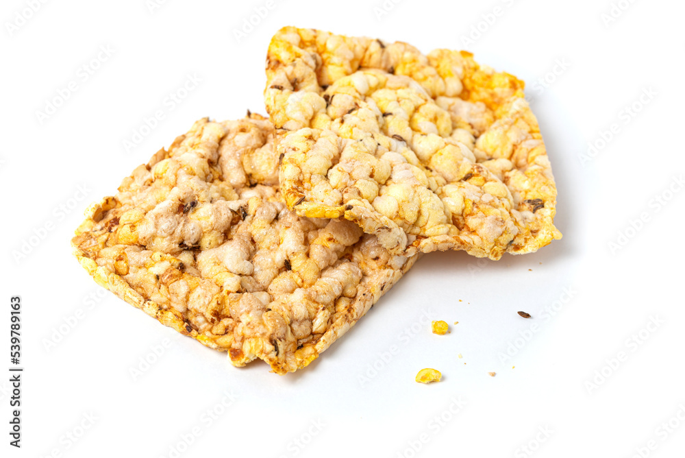 Macro photo of whole grain crusty bread. Snacks made of air wheat or corn on a white background. Macro photo of whole grain crusty bread. Snacks made of air wheat or corn on a white background.