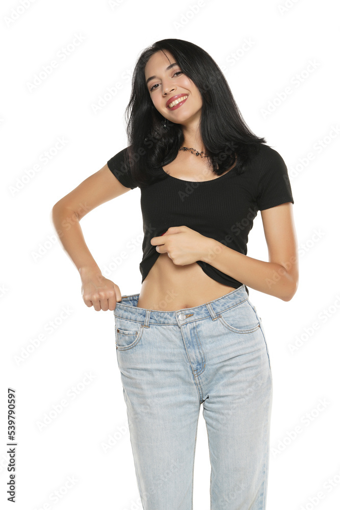 Weight loss happy woman isolated on a white background. Slim Body Weight loss happy woman isolated on a white background. Slim Body