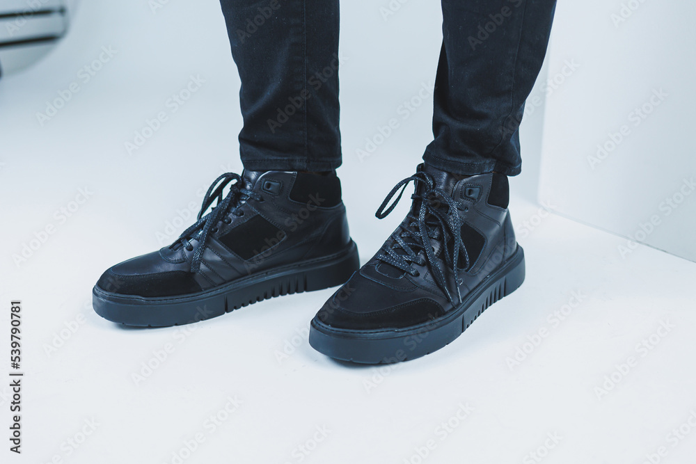 Men's casual shoes in black color made of genuine leather, men on shoes in black lace shoes. High quality photo