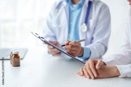 Doctor who records a patient's detailed information or medication history is evaluating medications and vaccines for the intended treatment. or if there are any side effects.