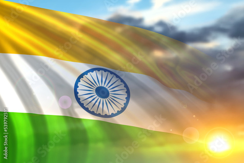 Tricolor Indian Flag on background of sunset or sunrise. National holidays celebration