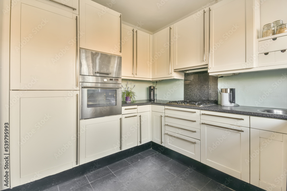 © ADDICTIVE STOCK - Modern kitchen with built in stove and white furniture © ADDICTIVE STOCK - Modern kitchen with built in stove and white furniture