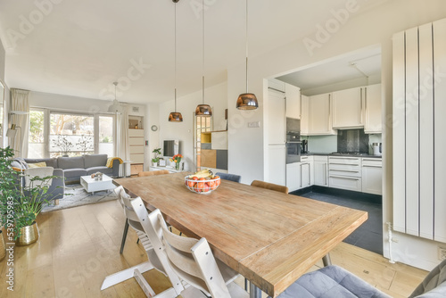 Spacious modern apartment with cozy sofa dining table and kitchen