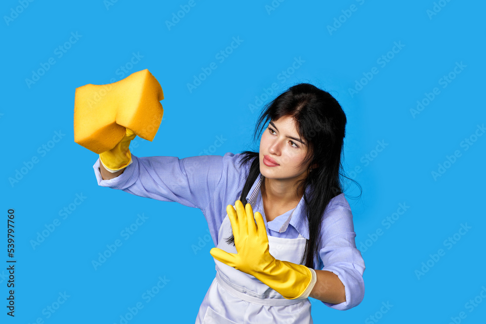 woman in gloves and cleaner apron with detergent sprayer woman in gloves and cleaner apron with detergent sprayer