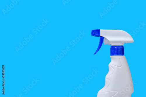 Sprayer for washing windows and plumbing blue background.