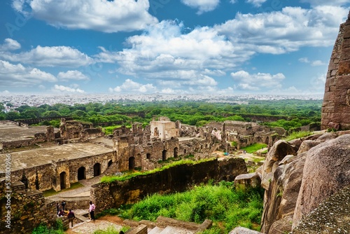 Canvas Print High-angle of Golconda Fort ruins with grass around and cloudy sky background