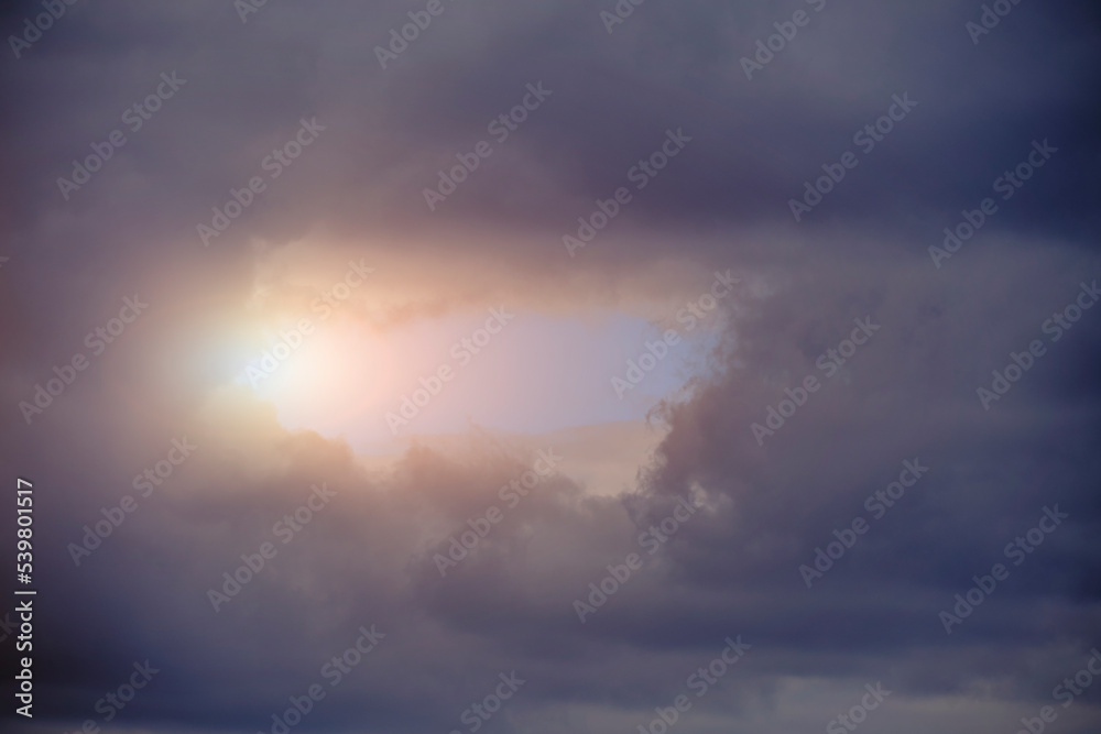 Breaking sunlight through gap of storm clouds. Breaking sunlight through gap of storm clouds.