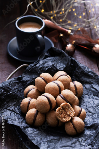Lady's kisses, traditional Italian nut cookies with coffee and chocolate filling.
