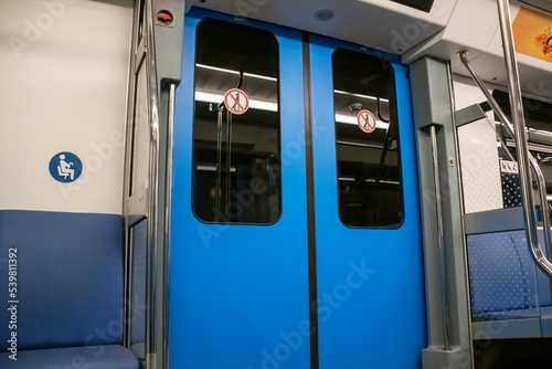 The doors in the subway car are blue © Vera Aksionava