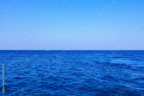 View of the open sea from the yacht. Background with selective focus