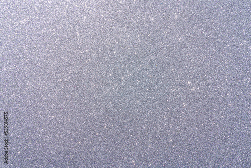 Background with sparkles. Backdrop with glitter. Shiny textured surface. Dark grayish blue photo