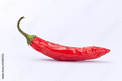 Red pepper on a white background.