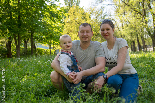Family with baby in the park © Daria