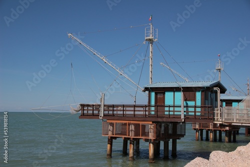 Italy, Marche, Fano: Wooden constructions on the water, called Trabucchi. photo