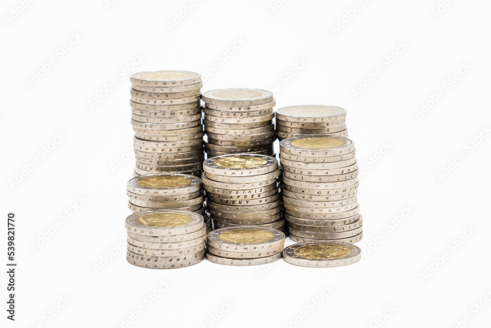 A stack of coins in ascending order. Business and financial growth and improvement concept A stack of coins in ascending order. Business and financial growth and improvement concept