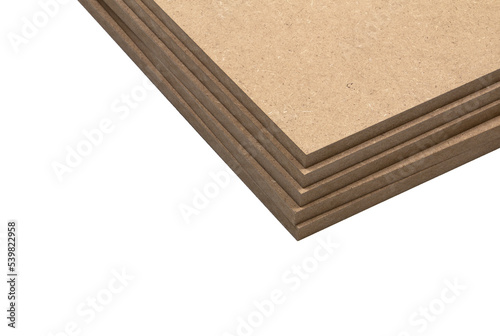 Five boards of raw mdf stacked on top of each other in the same plane.