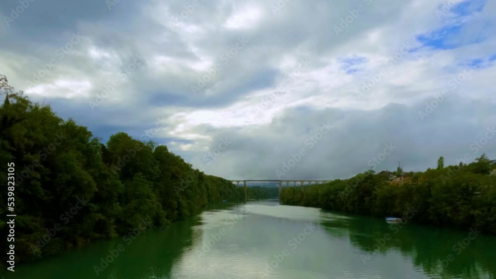 Timelapse of Rhine river with Eglisau bridge in background Timelapse of Rhine river with Eglisau bridge in background