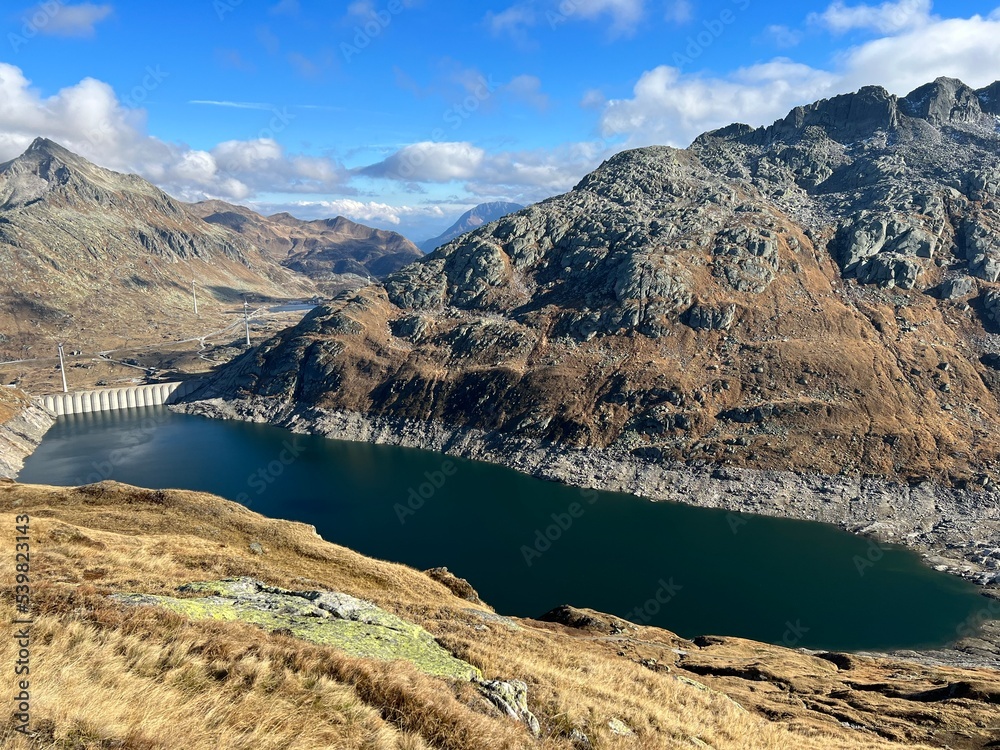 Naklejka premium Artificial reservoir lake Lago di Lucendro or accumulation lake Lucendro in the Swiss alpine area of the St. Gotthard Pass (Gotthardpass), Airolo - Canton of Ticino (Tessin), Switzerland (Schweiz)