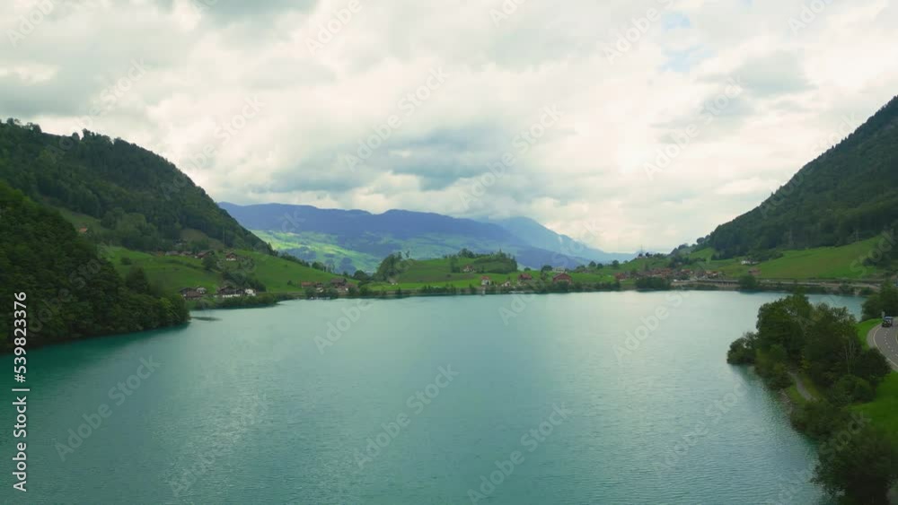 Flying above Lungernsee with beautiful blue water Flying above Lungernsee with beautiful blue water