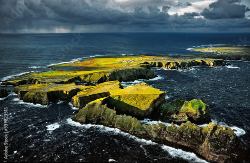 Tory Island, Co. Donegal, Ireland. Celtic Balor's Fort on flat top peninsula. Hut circles, defence ditch and rampart visible. photo