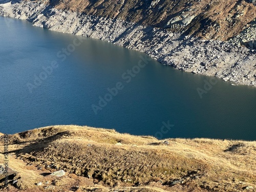 Artificial reservoir lake Lago di Lucendro or accumulation lake Lucendro in the Swiss alpine area of the St. Gotthard Pass (Gotthardpass), Airolo - Canton of Ticino (Tessin), Switzerland (Schweiz) photo