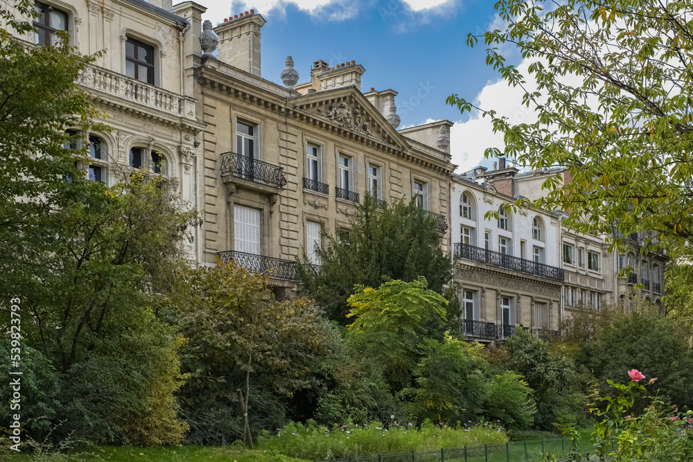 Paris, beautiful ancient building in the parc Monceau, public garden, in a luxury area
