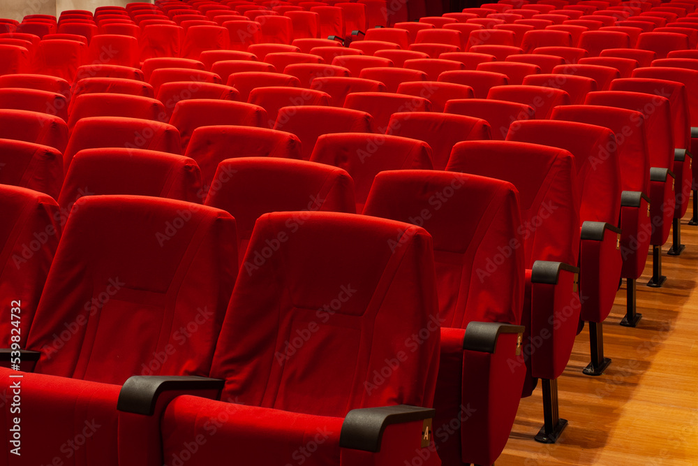 Fototapeta premium Red armchairs of a empty cinema