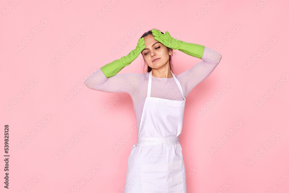 tired woman in gloves and cleaner apron tired woman in gloves and cleaner apron
