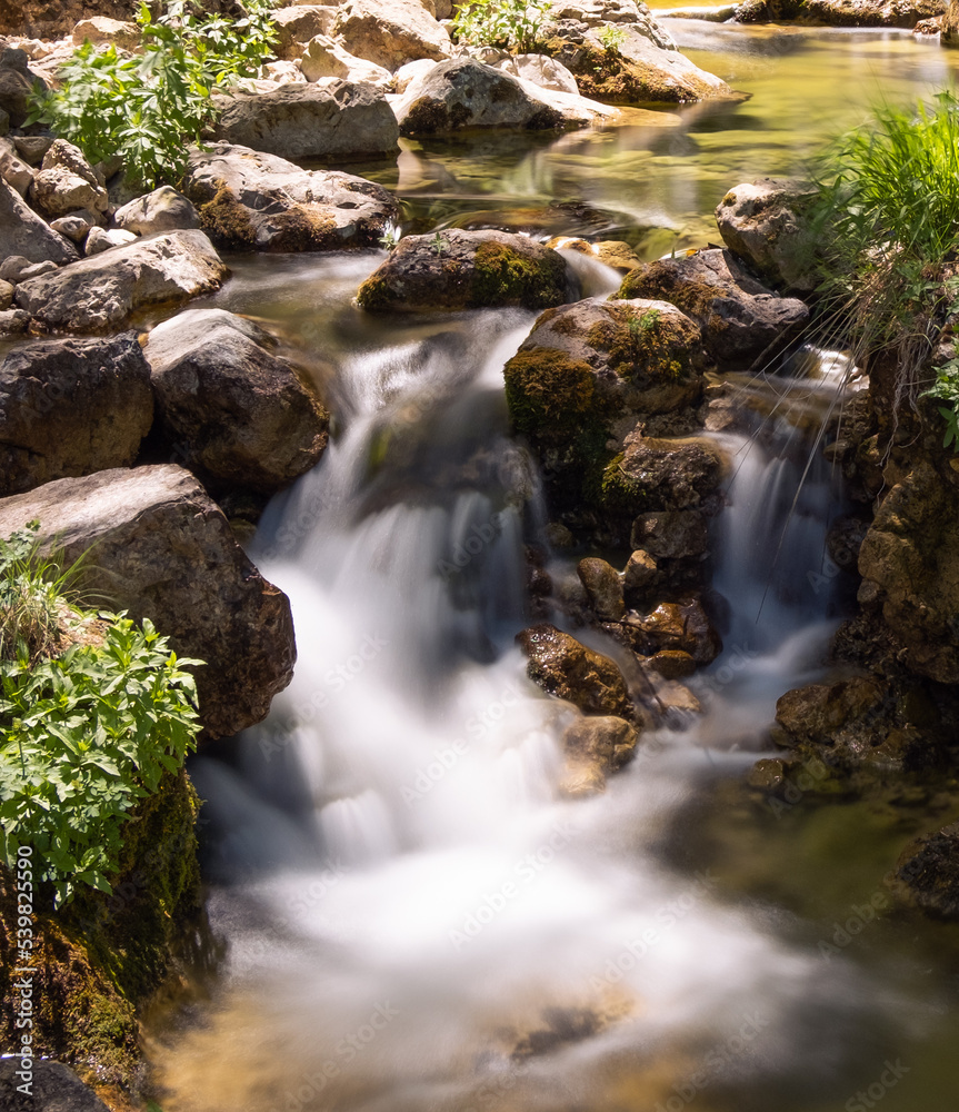 Small waterfall with silk effect in the forest of the Mundo River Natural Park. Small waterfall with silk effect in the forest of the Mundo River Natural Park.